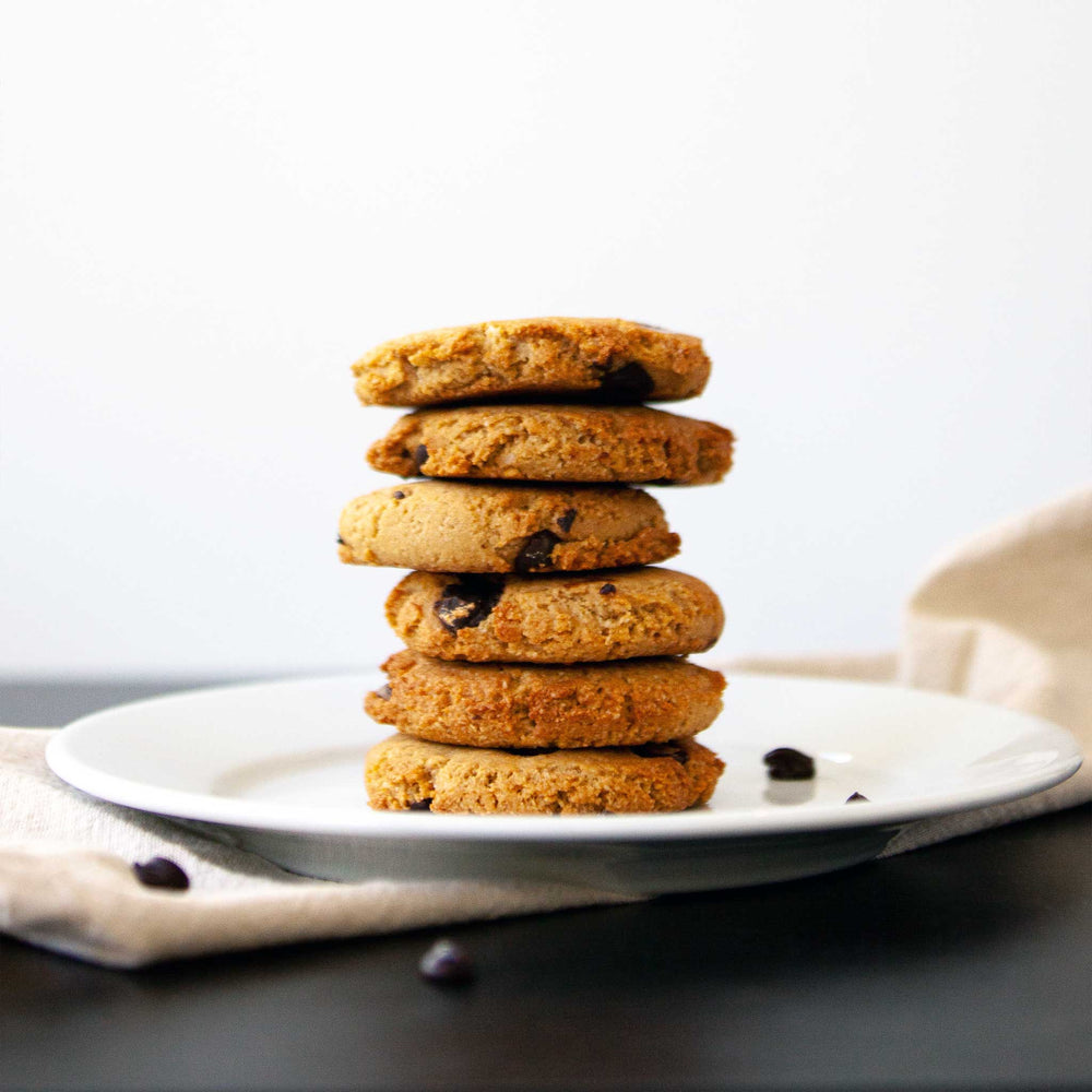 
                  
                    A photo of 6 chocolate chip cookies arranged into a vertical tower, on top of a plate.
                  
                