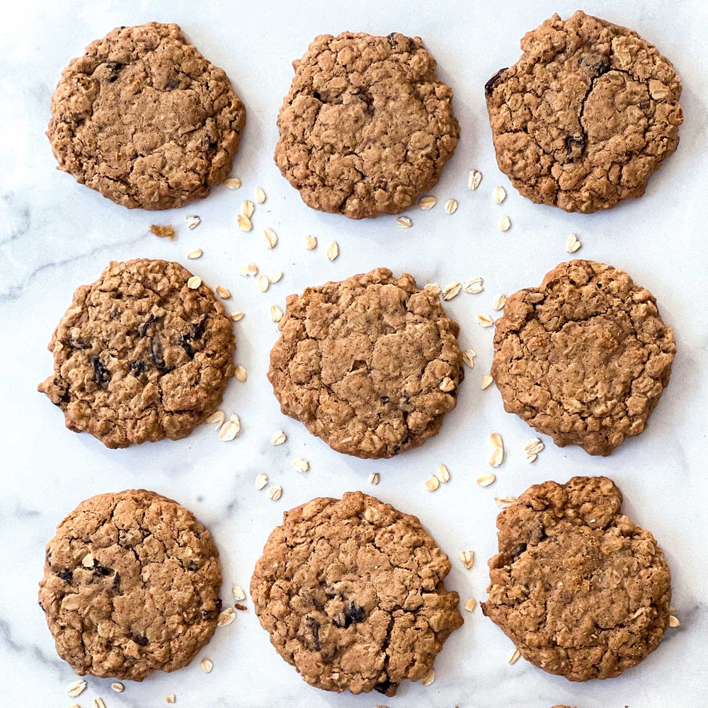 
                  
                    A photo of 9 oatmeal raisin cookies arranged in a three-by-three grid on a marble surface.
                  
                